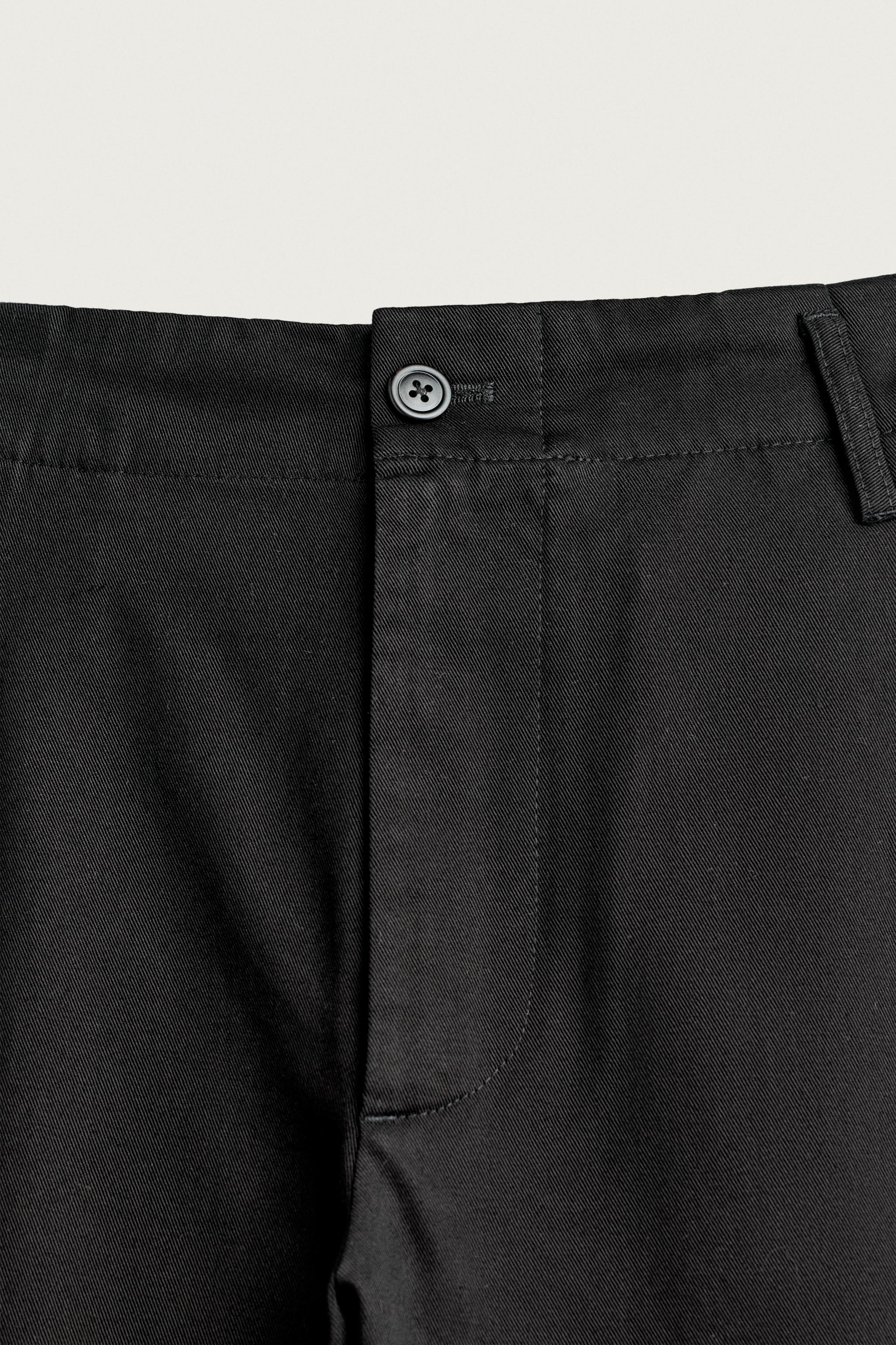RELAXED FIT PLEATED CHINO PANTS